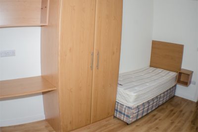 Thomond Village single bed bed room